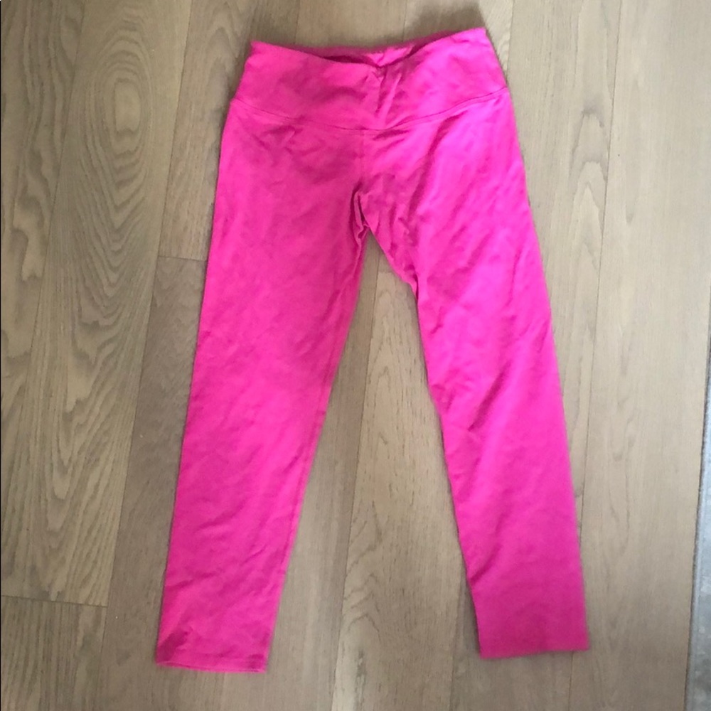 Pink hard tail leggings with Pilates logo on back